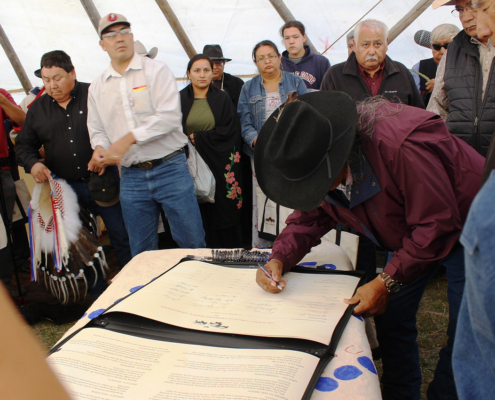 Iinii Treaty Signing Morris Little Wolf signing the Iinii Treaty 2014